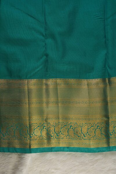 Plain sea green unstitched blouse piece featuring the intricate gold zari Kanchi border, perfectly matching the maroon checked semi pattu saree.