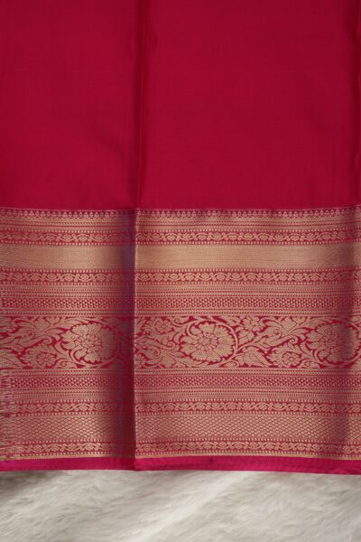 Plain pink unstitched blouse piece featuring the intricate gold zari Kanchi border, perfectly matching the green semi pattu saree.
