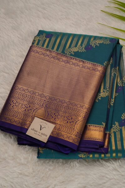 Elegantly folded outlook of the green semi Kanjeevaram art silk saree, displaying the stunning contrast between the vibrant green body and the deep purple border.
