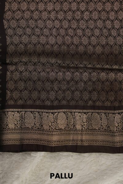 Heavy brocade coffee brown pallu of a lightweight Kanchi Pattu saree, featuring a dense all-over geometric and floral diamond zari mesh pattern.