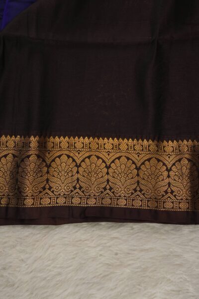 Plain snuff brown unstitched blouse piece with an elegant gold zari arch border matching the navy blue lightweight Kanchi Pattu saree.