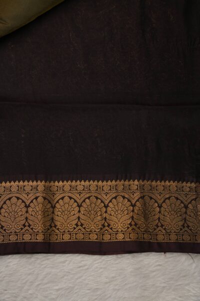 Plain coffee brown unstitched blouse piece with an elegant gold zari arch border matching the navy blue lightweight Pattu saree.