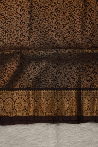 Heavy brocade coffee brown pallu of a lightweight Pattu saree, featuring a dense all-over gold zari floral and vine pattern.