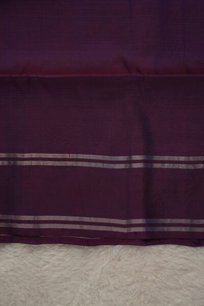 Plain deep magenta unstitched blouse piece with elegant metallic zari stripes matching the light lavender checked Pattu saree.