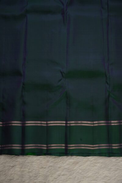 Plain bottle green unstitched blouse piece with elegant metallic stripes matching the lavender lightweight Pattu saree.