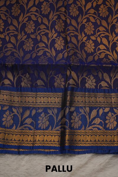 Heavy brocade royal blue pallu of a lightweight Pattu saree, featuring a dense all-over gold zari floral and vine pattern.