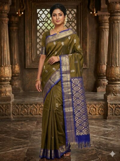 Elegant antique copper lightweight Pattu saree with floral zari buttis and a contrast royal blue geometric zari pallu with tassels.