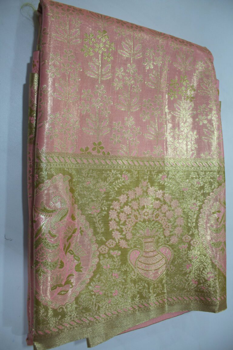 Folded Pink Semi Kanchi Pattu saree showing an all-over gold zari botanical brocade and a heavy metallic olive-gold border with a large peacock paisley and floral vase motif accented with pink Meenakari weaving.