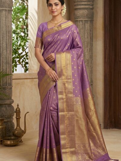 Beautiful woman wearing a mauve lavender premium semi Kanchi Pattu saree featuring gold zari checks, a thick gold zari border, and a pallu with tassels.