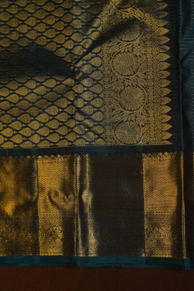 Another detailed view showcasing the magnificent gold zari weaving on the navy blue Kanchi border and pallu of the pure handloom saree.