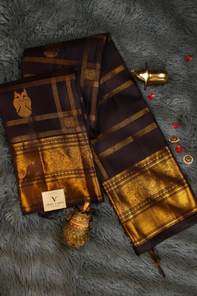 Elegantly draped full view of the pure handloom dark brown Kanjeevaram pattu saree, displaying the stunning overall texture of the vintage zari checks.