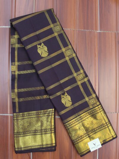 Folded deep plum pure handloom Kanjeevaram silk saree featuring gold zari checks with twin-bird motifs, showcasing a heavy gold zari border and pallu intricately woven with elephants and peacocks.