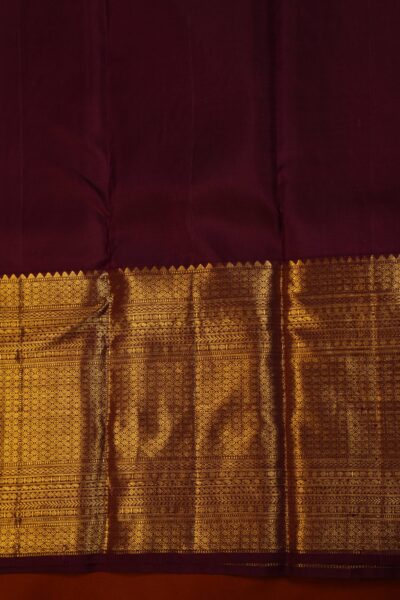 Plain maroon unstitched blouse piece featuring the intricate gold zari Kanchi border, perfectly matching the tea green handloom saree.