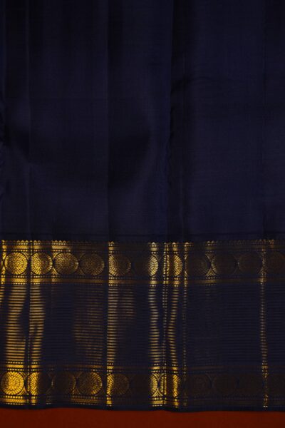 Contrast navy blue unstitched blouse piece featuring vintage gold zari lines and the intricate Kanchi border, perfectly matching the pista green handloom saree.