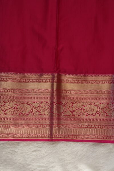 Plain pink unstitched blouse piece featuring the intricate gold zari Kanchi border, perfectly matching the purple semi pattu saree.
