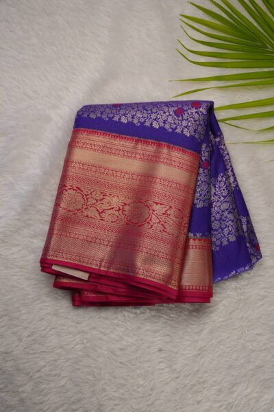 Elegantly folded outlook of the purple semi pattu art silk saree, displaying the stunning contrast between the rich purple body and the vibrant pink border.