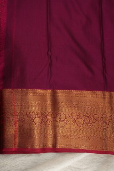 Plain pink unstitched blouse piece featuring the intricate gold zari Kanchi border, perfectly matching the sea green semi Kanjeevaram saree.