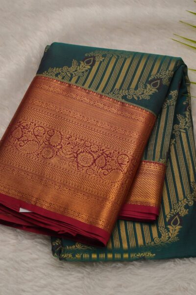 Elegantly folded outlook of the sea green semi Kanjeevaram art silk saree, displaying the stunning contrast between the soft green body and the vibrant pink border.